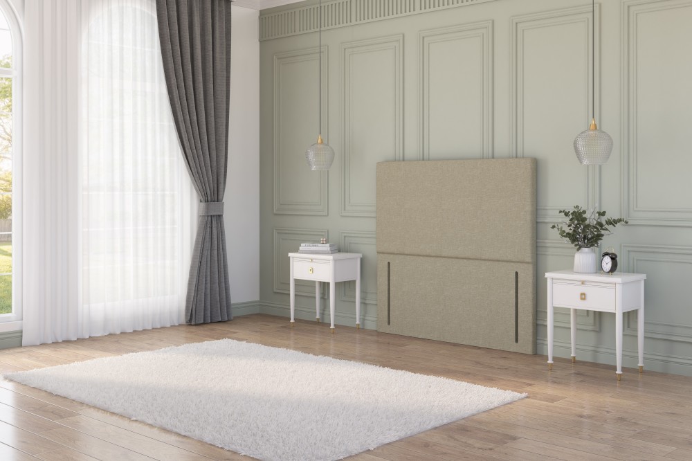 Beige plush velvet strutted headboard with a chesterfield design in a rustic cottage bedroom between two bedside tables.