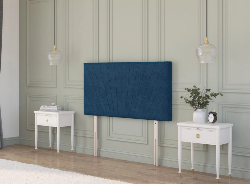  Plush velvet strutted navy headboard with a sunrise pattern situated in a modern interior with houseplants and a bookshelf.