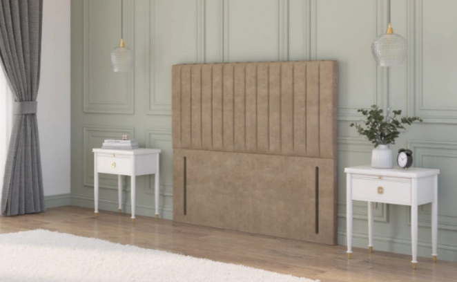  Beige plush velvet strutted headboard with a chesterfield design in a rustic cottage bedroom between two bedside tables.